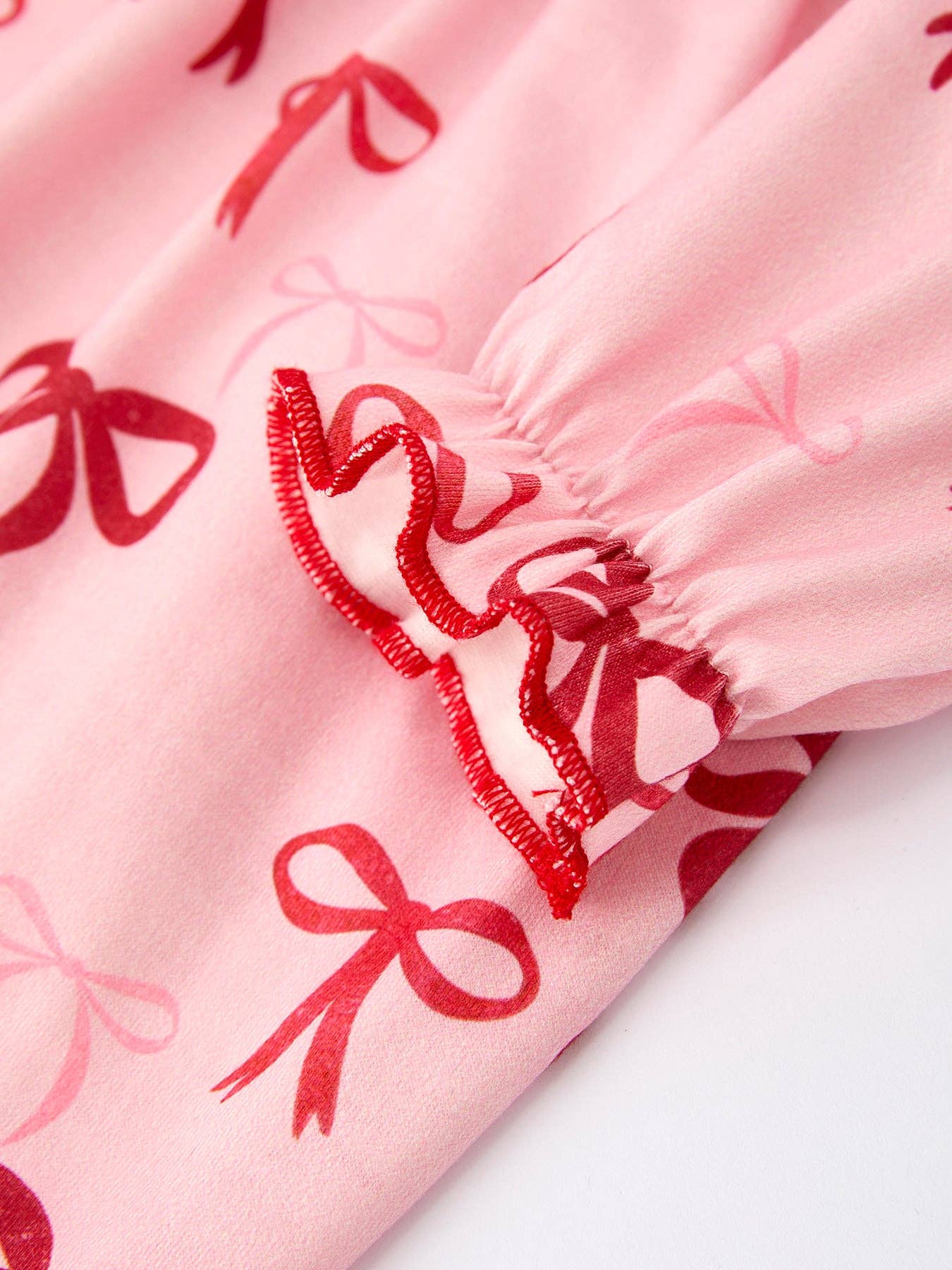 Christmas Bow Print Babygrow